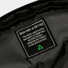closeup photo of the sustainability tag inside the bag, advertising the recycled fabric